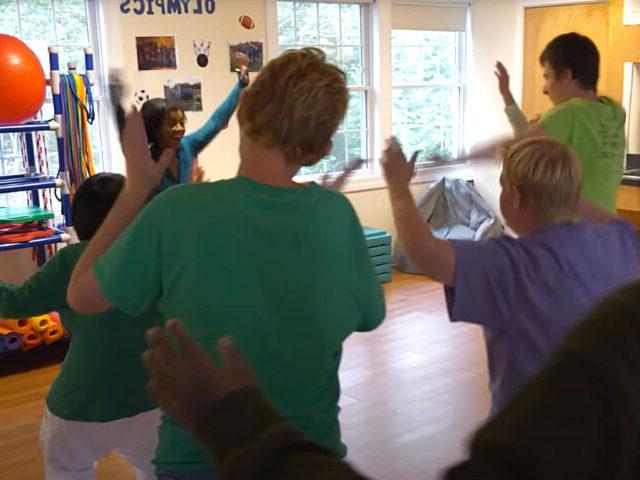 Students dance for a physical fitness activity in P.E.